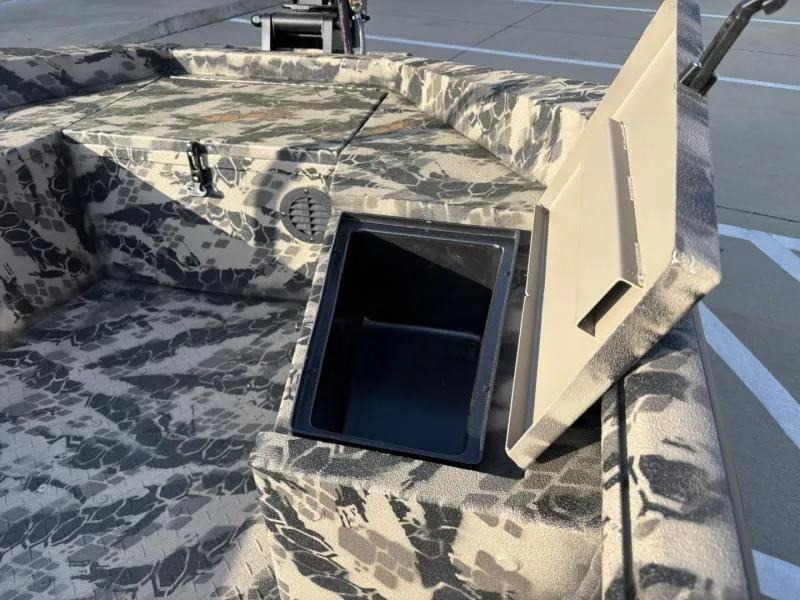 Slide: The Image of 2025 Havoc Boats 1653 MSTC with camouflage interior and open storage compartment. - 11
