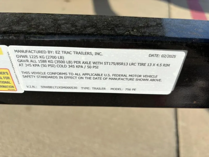 Slide: The Image of Label on trailer by EZ Trac Trailers, Inc., manufactured February 2025. - 13