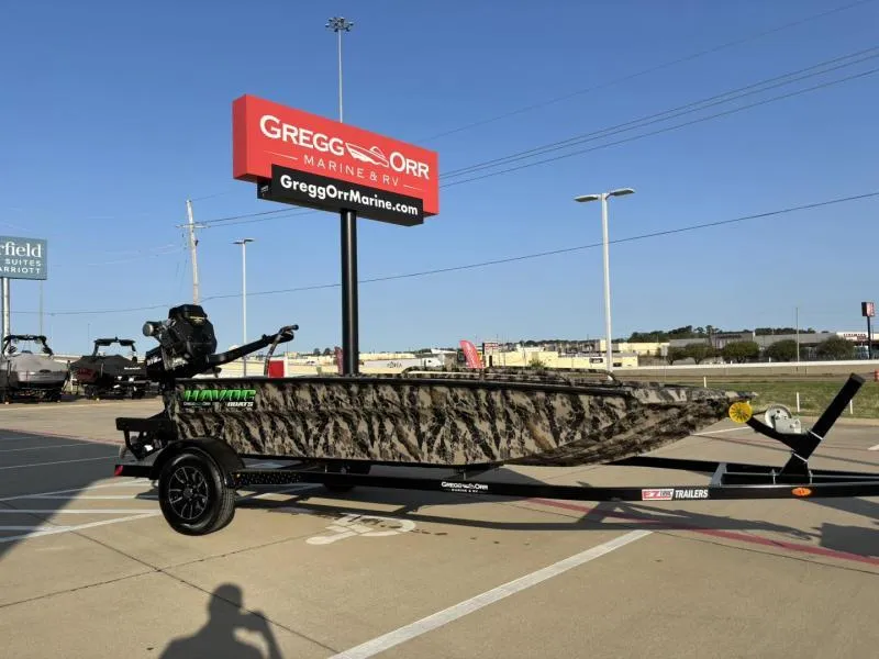 Slide: The Image of 2025 Havoc Boats 1653 MSTC camo-patterned boat on trailer at Gregg Orr Marine. - 4