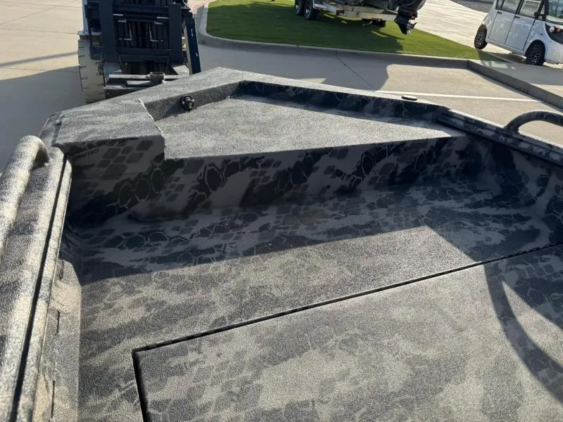 Slide: The Image of 2025 Havoc Boats 1653 MSTC with camouflage interior design on display. - 7