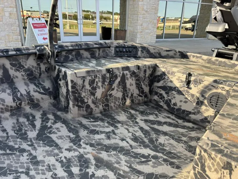 Slide: The Image of 2025 Havoc Boats 1653 MSTC interior with camouflage design and control panel. - 9