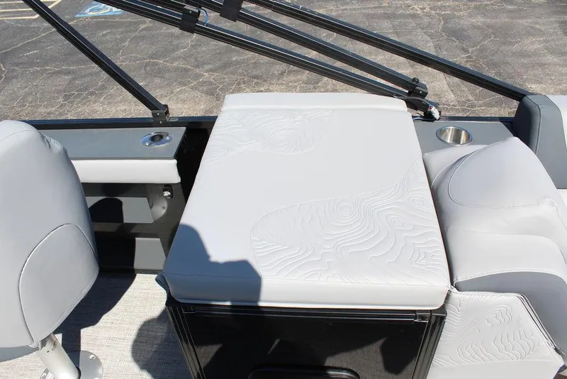 Slide: The Image of 2025 Avalon GEO FISH REAR FISH boat interior with cushioned seating and cup holder. - 23