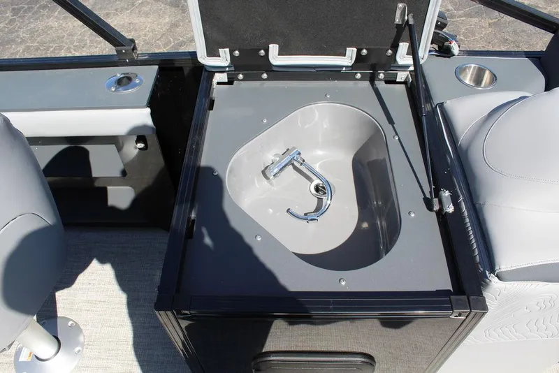 Slide: The Image of Open storage compartment in 2025 Avalon GEO FISH REAR FISH boat interior. - 24