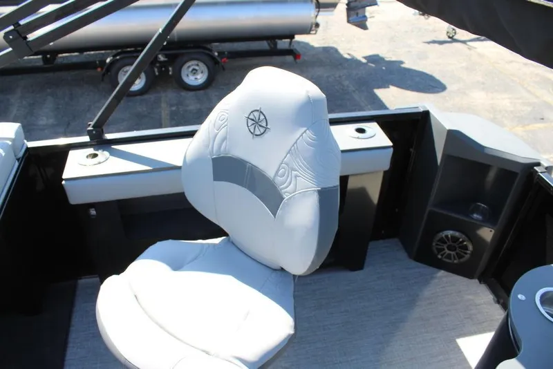 Slide: The Image of Captain's chair on 2025 Avalon GEO FISH REAR FISH boat, featuring sleek design and speaker system. - 26