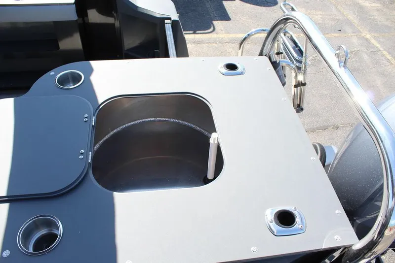 Slide: The Image of 2025 Avalon GEO FISH REAR FISH boat with integrated fishing station and cup holders. - 28