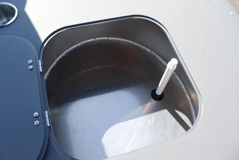 Slide: The Image of Open storage compartment in 2025 Avalon GEO FISH REAR FISH boat. - 29