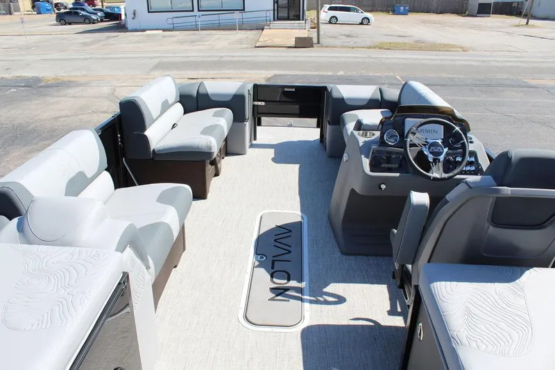 Slide: The Image of 2025 Avalon GEO FISH REAR FISH boat interior with spacious seating and modern dashboard. - 30
