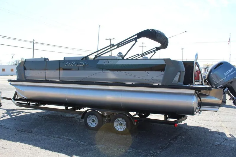Slide: The Image of 2025 Avalon GEO FISH REAR FISH pontoon boat on trailer, side view. - 7