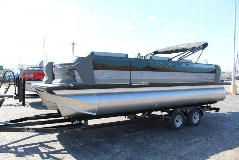Slide: The Image of 2025 Avalon GEO FISH REAR FISH pontoon boat on trailer, side view. - 8