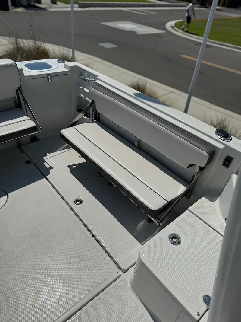 Slide: The Image of 2024 Finseeker 245 WA boat interior with foldable seating and modern design. - 5
