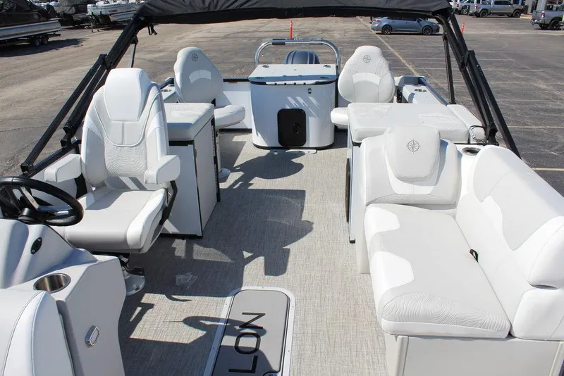 Slide: The Image of 2025 Avalon GEO FISH REAR FISH boat interior with white seating and steering console. - 10