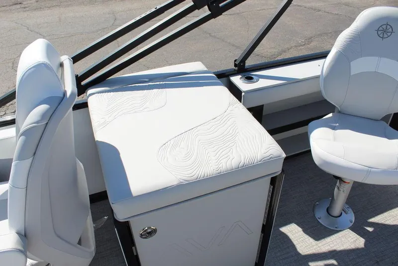 Slide: The Image of 2025 Avalon GEO FISH REAR FISH boat interior with white seating and storage compartment. - 12
