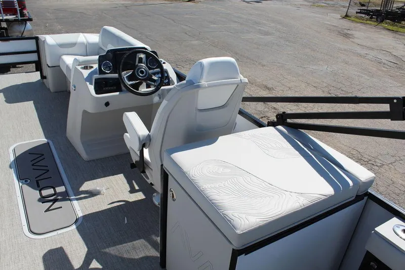 Slide: The Image of 2025 Avalon GEO FISH REAR FISH boat interior with steering console and seating. - 20