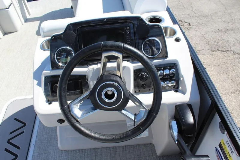 Slide: The Image of Steering console of 2025 Avalon GEO FISH REAR FISH boat with gauges and controls. - 22