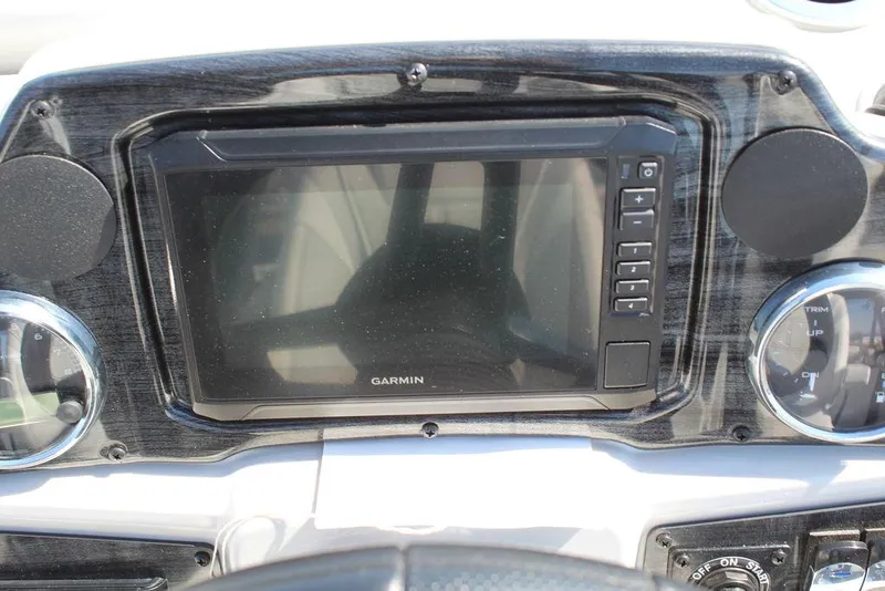 Slide: The Image of Dashboard of 2025 Avalon GEO FISH REAR FISH with Garmin display and controls. - 23