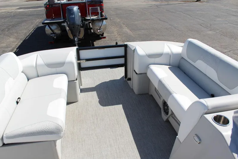 Slide: The Image of 2025 Avalon GEO FISH REAR FISH pontoon boat interior with white seating and motor view. - 24