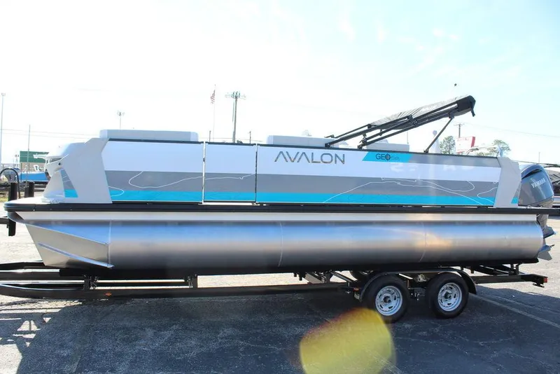 Slide: The Image of 2025 Avalon GEO FISH REAR FISH pontoon boat on trailer, side view. - 6