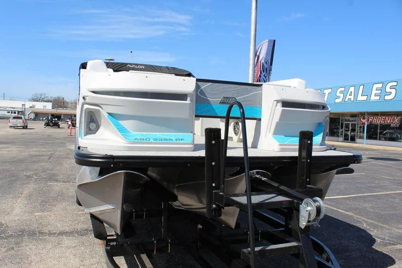 Slide: The Image of 2025 Avalon GEO FISH REAR FISH boat on trailer at dealership. - 8