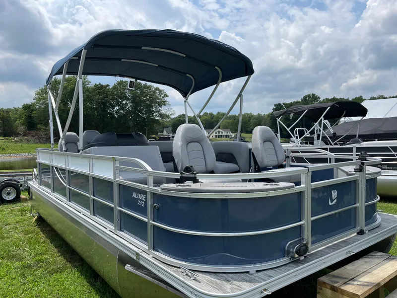Slide: The Image of 2024 Landau A'Lure 212 Fishing pontoon boat with canopy, parked on grass. - 5