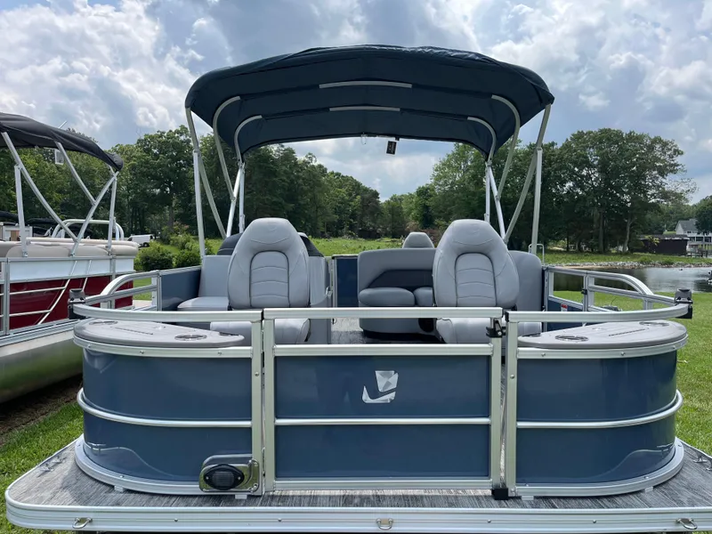 Slide: The Image of 2024 Landau A'Lure 212 Fishing boat with canopy, gray seating, and sleek design on grassy area. - 7