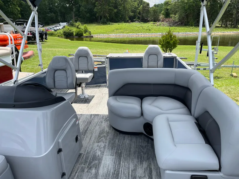 Slide: The Image of 2024 Landau A'Lure 212 Fishing boat interior with gray seating and scenic outdoor view. - 9