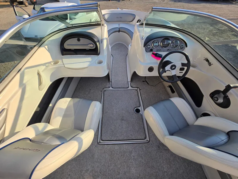 Slide: The Image of 2008 Sea Ray 205 Sport boat interior with seating and dashboard view. - 13