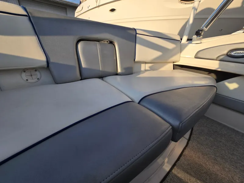 Slide: The Image of 2008 Sea Ray 205 Sport boat interior seating with gray and white upholstery. - 15