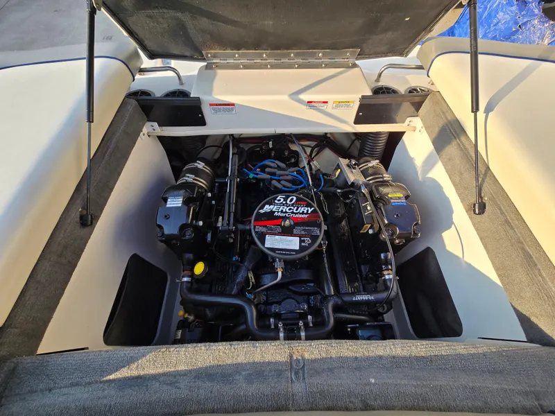 Slide: The Image of 2008 Sea Ray 205 Sport boat engine compartment with 5.0 Mercury engine. - 22