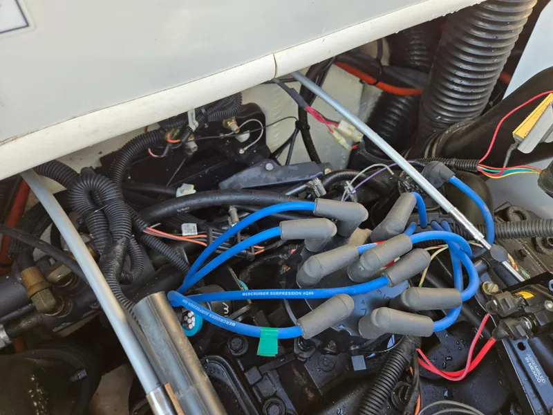 Slide: The Image of Engine compartment of a 2008 Sea Ray 205 Sport boat with visible wiring and components. - 25