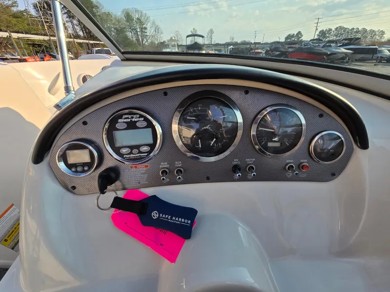 Slide: The Image of Dashboard of a 2008 Sea Ray 205 Sport boat with gauges and controls. - 27