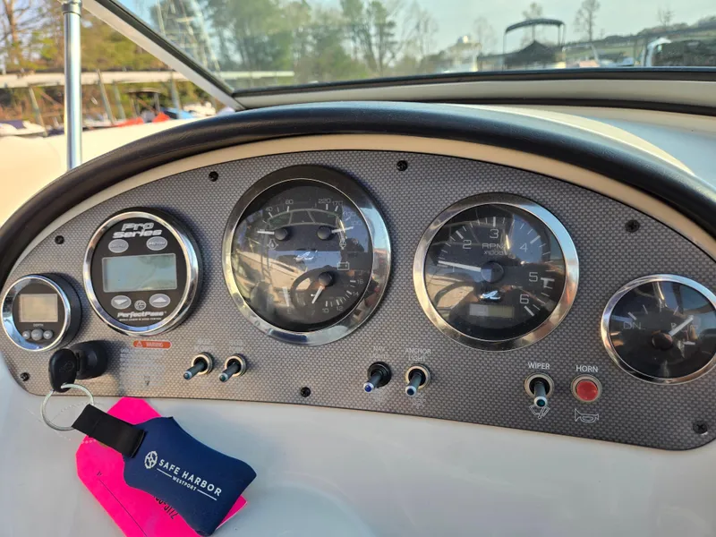 Slide: The Image of Dashboard of 2008 Sea Ray 205 Sport boat with gauges and controls. - 28