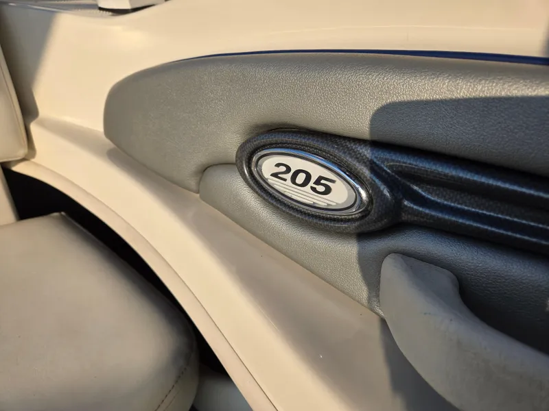Slide: The Image of Interior detail of a 2008 Sea Ray 205 Sport boat, featuring a "205" emblem. - 33