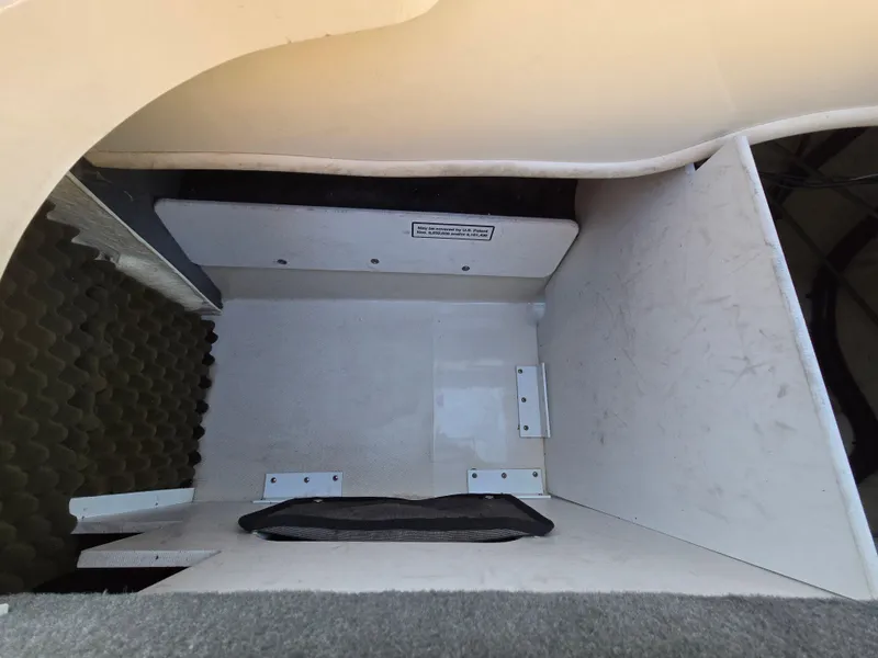 Slide: The Image of Storage compartment in a 2008 Sea Ray 205 Sport boat, featuring a clean interior. - 40