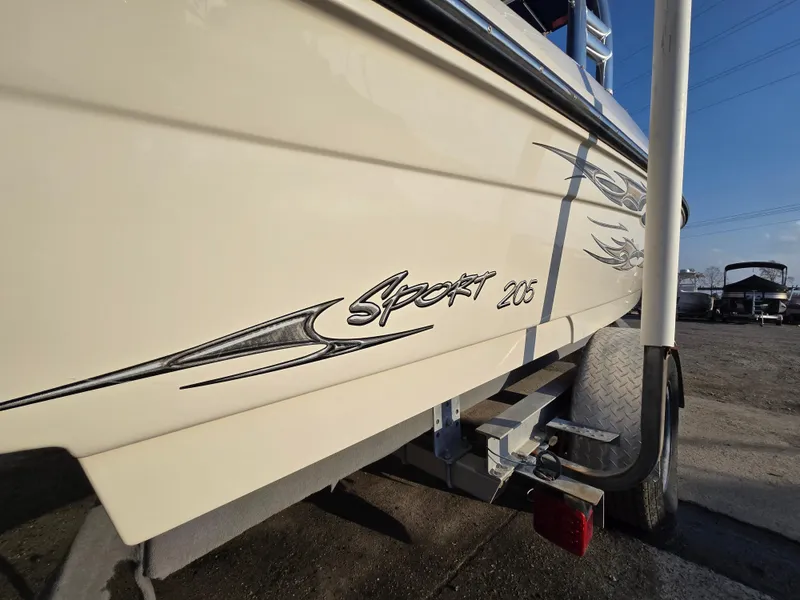 Slide: The Image of 2008 Sea Ray 205 Sport boat on trailer, side view with logo detail. - 7