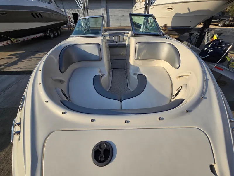 Slide: The Image of 2008 Sea Ray 205 Sport boat interior with seating and open bow design. - 8