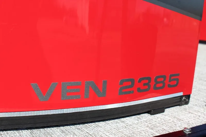 Slide: The Image of 2025 Avalon Venture 85 Center Console Fish, red exterior with "VEN 2385" marking. - 25