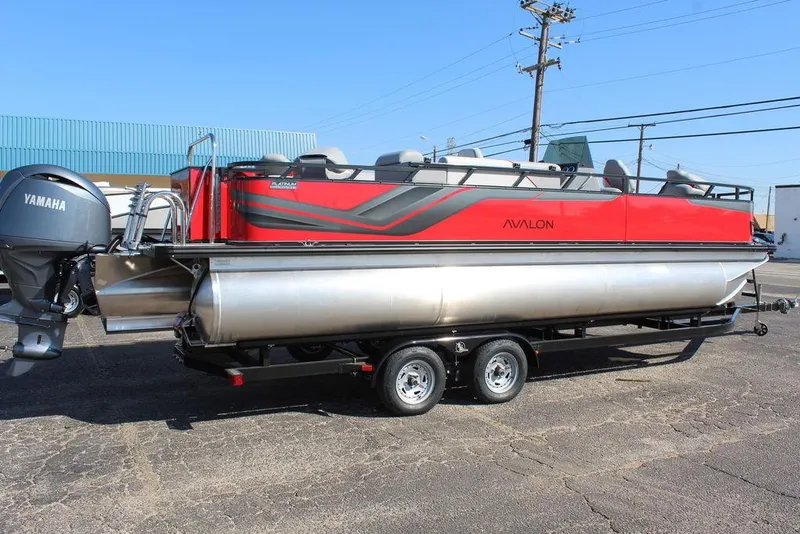 Slide: The Image of 2025 Avalon Venture 85 Center Console Fish boat, red and silver, on trailer with Yamaha engine. - 3