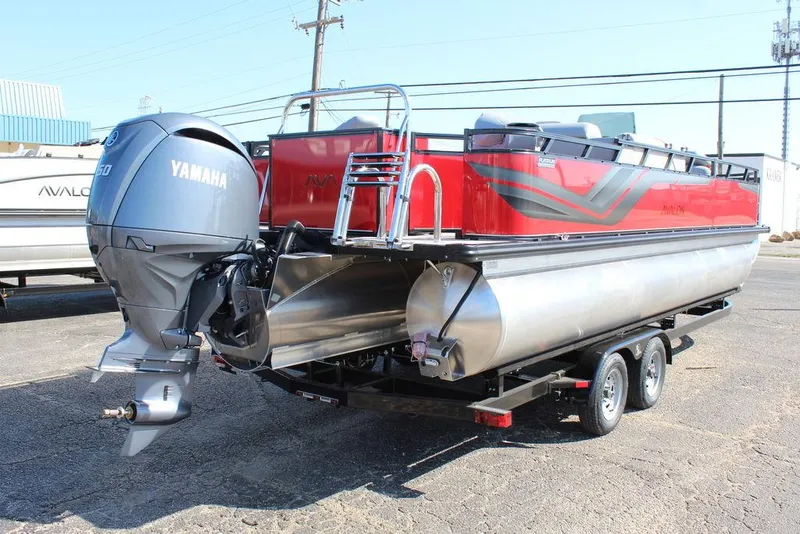 Slide: The Image of 2025 Avalon Venture 85 Center Console Fish boat, red and silver, on trailer with Yamaha engine. - 5