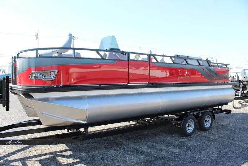 Slide: The Image of 2025 Avalon Venture 85 Center Console Fish boat, 23 FT, red and silver, on a trailer. - 7
