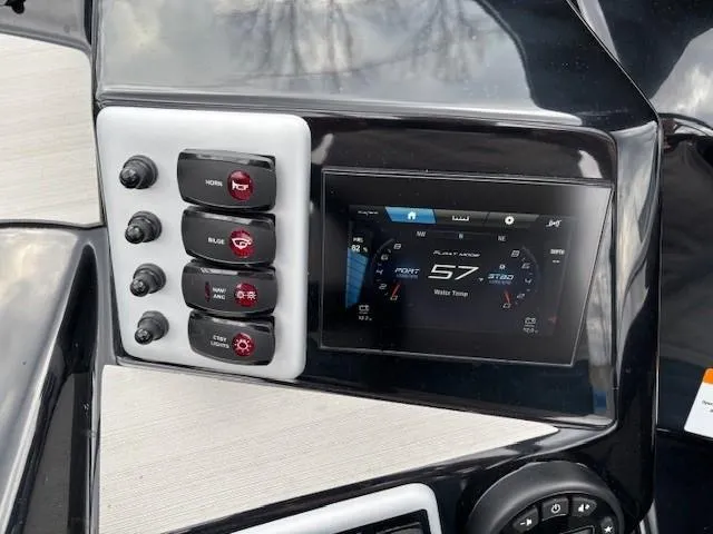 Slide: The Image of 2023 Yamaha Boats AR220 dashboard with control switches and digital display. - 15