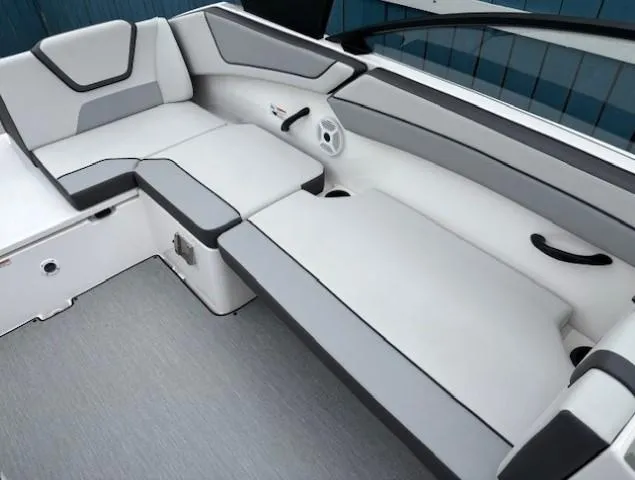 Slide: The Image of 2023 Yamaha Boats AR220 interior with gray and white seating, modern design. - 20