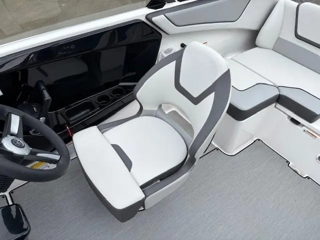 Slide: The Image of 2023 Yamaha Boats AR220 interior with sleek seating and modern design. - 21