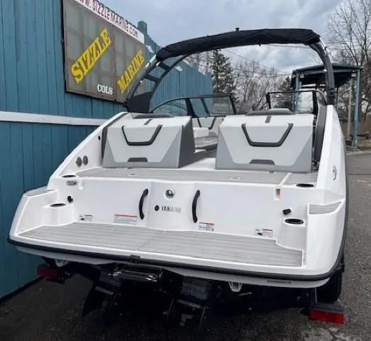 Slide: The Image of 2023 Yamaha Boats AR220, white exterior, displayed at Sizzle Marine dealership. - 4