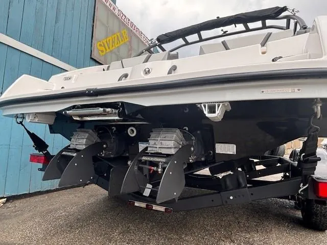 Slide: The Image of 2023 Yamaha Boats AR220, rear view showing dual engines and sleek design. - 5