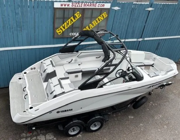 Slide: The Image of 2023 Yamaha AR220 boat on trailer, displayed at Sizzle Marine dealership. - 6