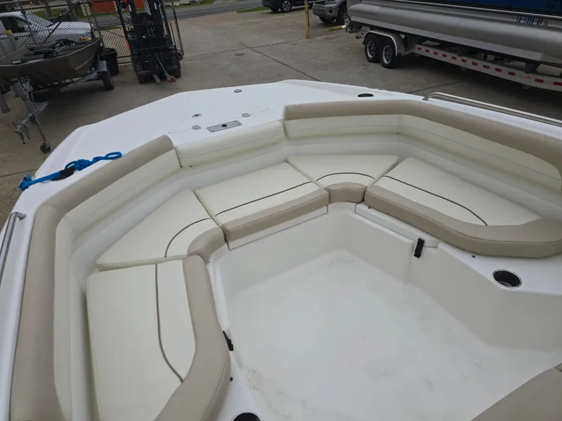 Slide: The Image of 2017 NauticStar 231 Coastal boat with spacious seating area and beige cushions. - 7