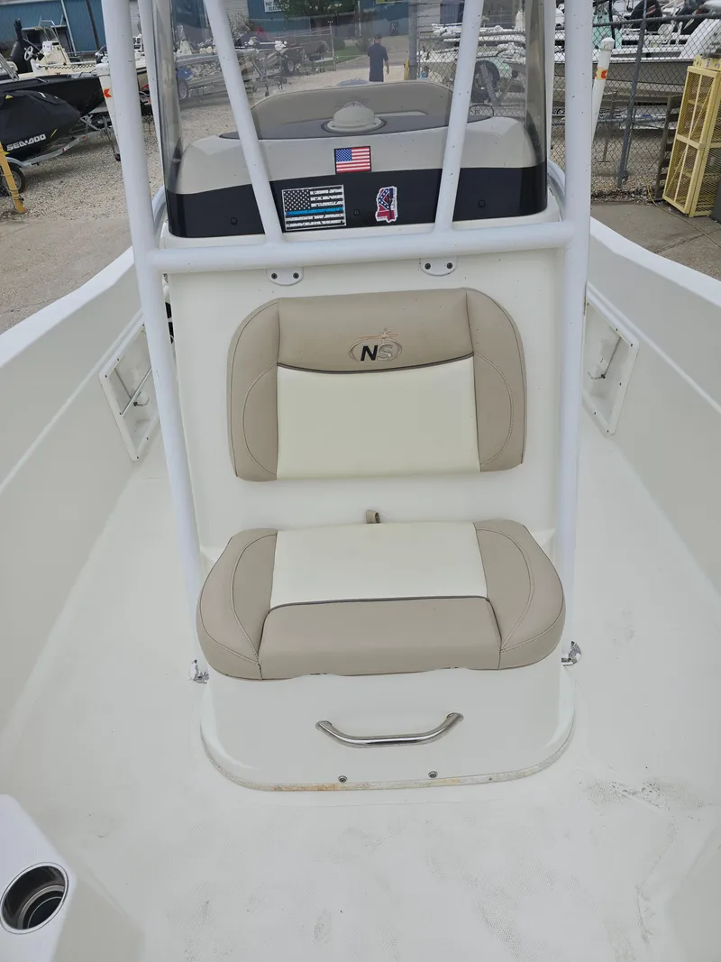 Slide: The Image of 2017 NauticStar 231 Coastal boat with beige seating and console. - 8