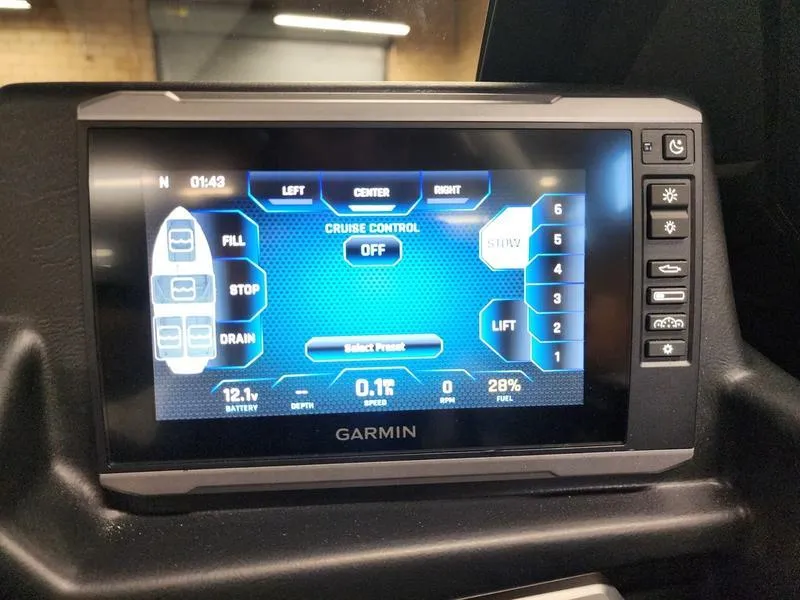 Slide: The Image of Garmin display in 2025 Axis T235 showing cruise control and system settings. - 14