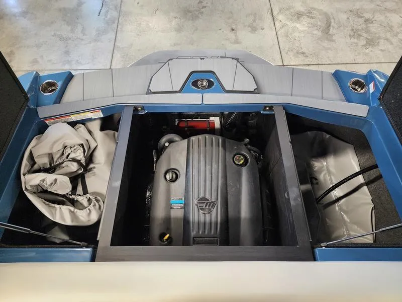Slide: The Image of Engine compartment of a 2025 Axis T235 boat, showcasing the engine and storage areas. - 21