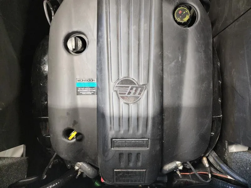 Slide: The Image of 2025 Axis T235 engine compartment with Monsoon branding and visible components. - 22